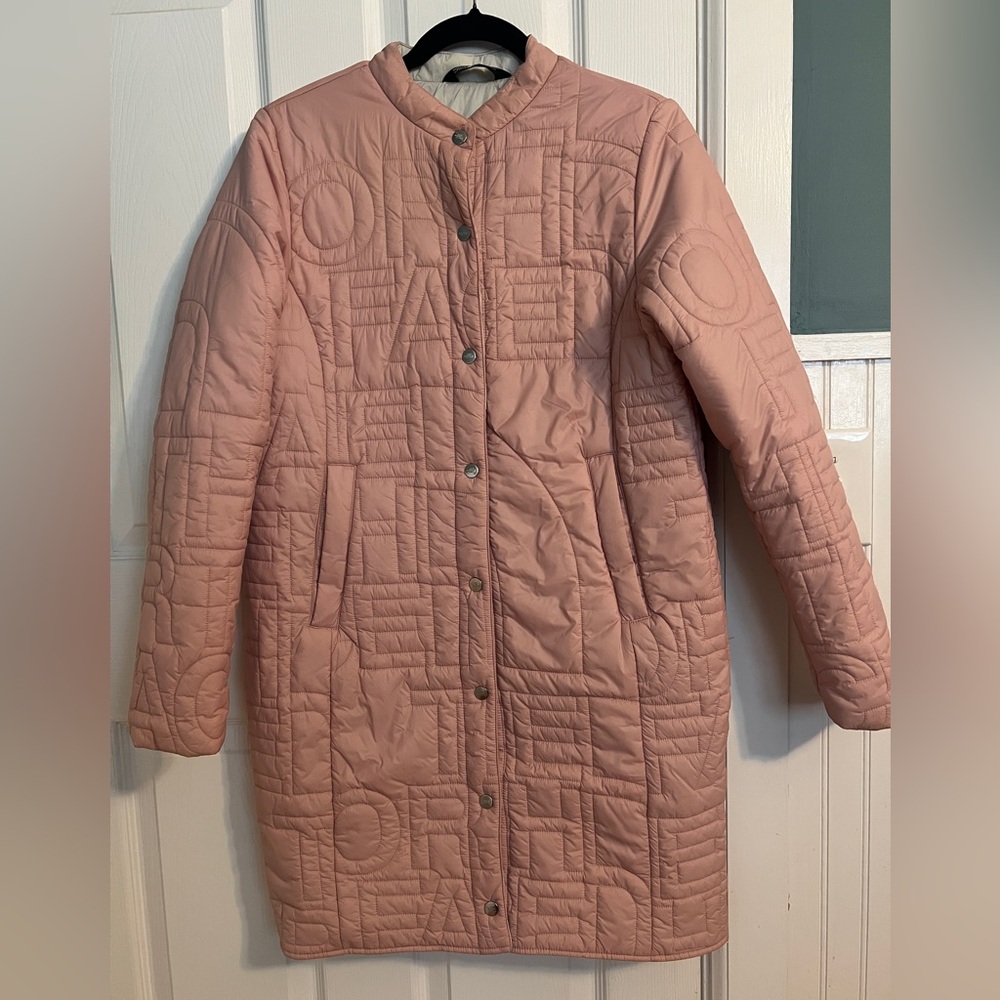 Women’s size Small North Face block print jacket with TNF logo impressions.
